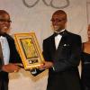 Ian Forbes (right), Vice President of AMCHAM, presents the AMCHAM Business & Civic Leadership Award of Excellence – Arts & Culture awarded to the National Dance Theatre Company to dancers Marlon Simms and Kerry Ann Henry at the awards gala at the Jamaica Pegasus on September 28, 2010.  