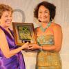 Diana Stewart (left), President of the American Chamber of Commerce of Jamaica (AMCHAM) presents the 2nd prize in the AMCHAM Business & Civic Leadership Awards of Excellence – Corporate Social Responsibility category to Thalia Lyn, Chair, NCB Foundation 