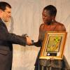 Joylene Griffith-Irving, Director of Public & Corporate Affairs & Executive Director, Scotia Foundation, Scotiabank Jamaica Limited, accepts a gift from Guillermo Brenes, Vice President, American Express Global Corporate Services at the American Chamber of Commerce of Jamaica (AMCHAM) Business & Civ